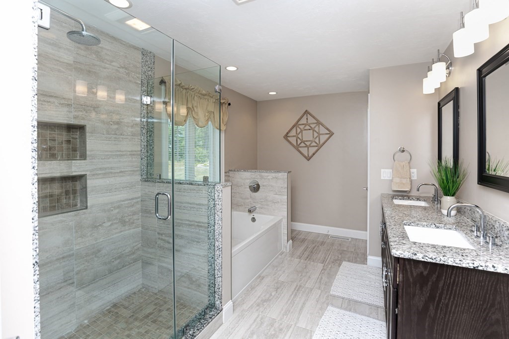 7 Pond Edge Trail Wareham, MA 02571 - Photo 21 of 30 a spacious bathroom with a granite countertop sink a mirror and shower