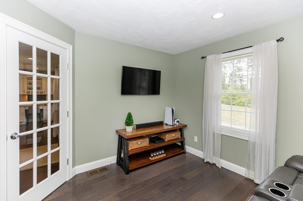 7 Pond Edge Trail Wareham, MA 02571 - Photo 25 of 30 a room with furniture and a flat screen tv