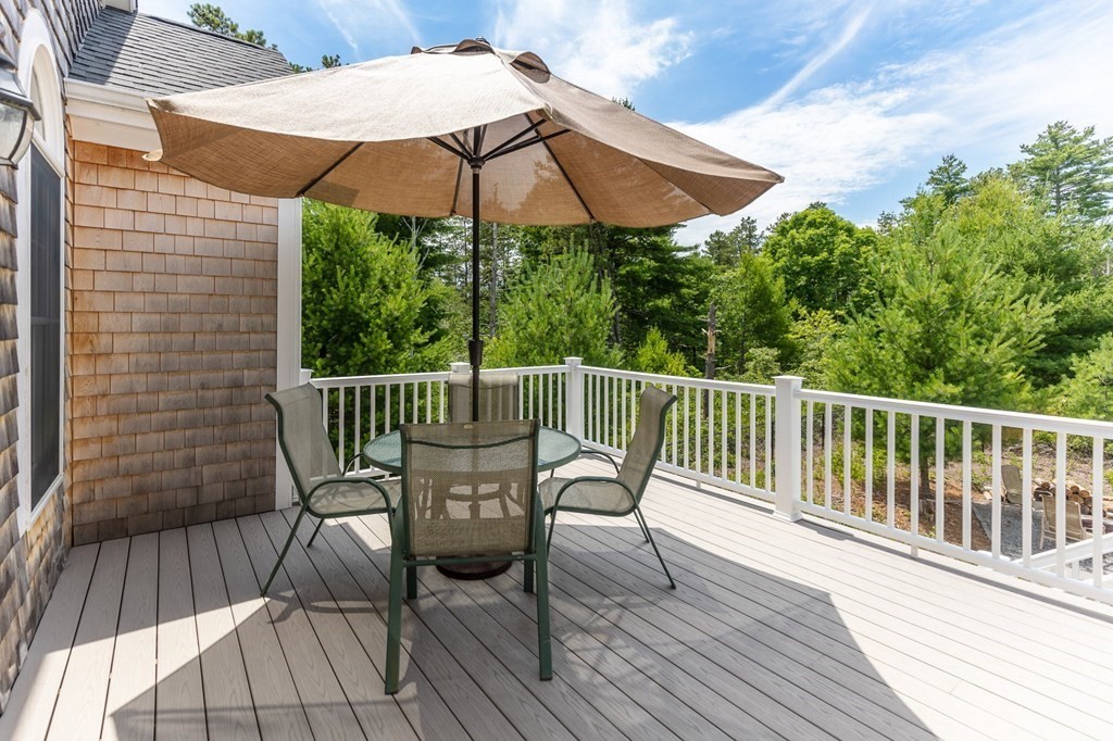 7 Pond Edge Trail Wareham, MA 02571 - Photo 26 of 30 a view of balcony with wooden floor and umbrella