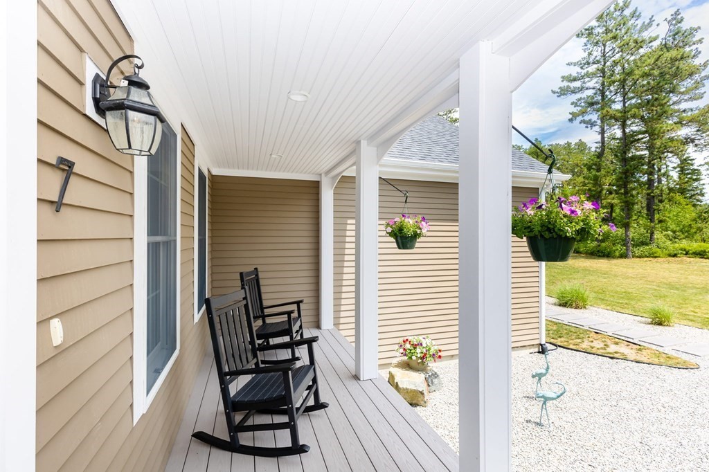 7 Pond Edge Trail Wareham, MA 02571 - Photo 3 of 30 a view of a porch with furniture and garden