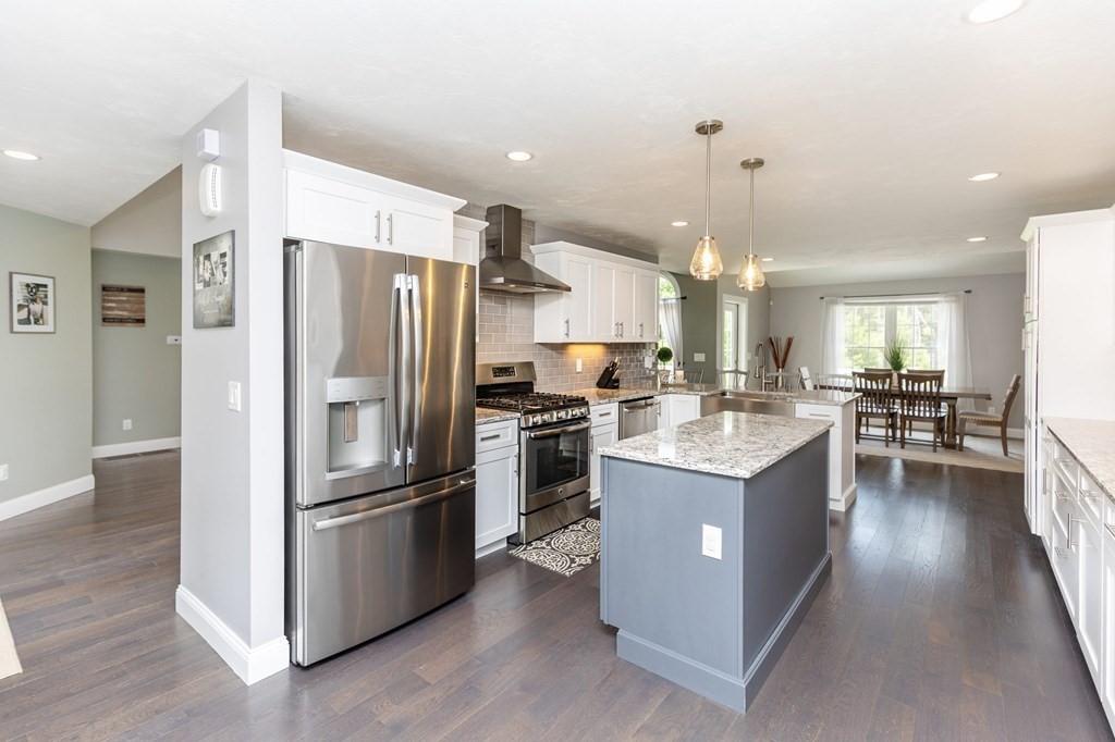 7 Pond Edge Trail Wareham, MA 02571 - Photo 6 of 30 a kitchen with kitchen island a sink stove and refrigerator