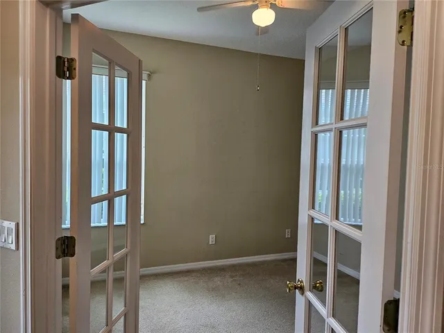 view of wooden floor and windows in a room