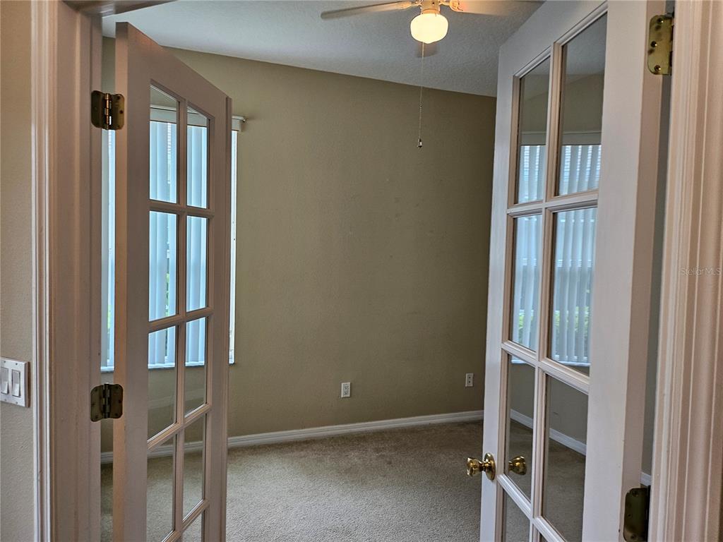 21 Raintree Circle Palm Coast, FL 32164 - Photo 7 of 10 view of wooden floor and windows in a room