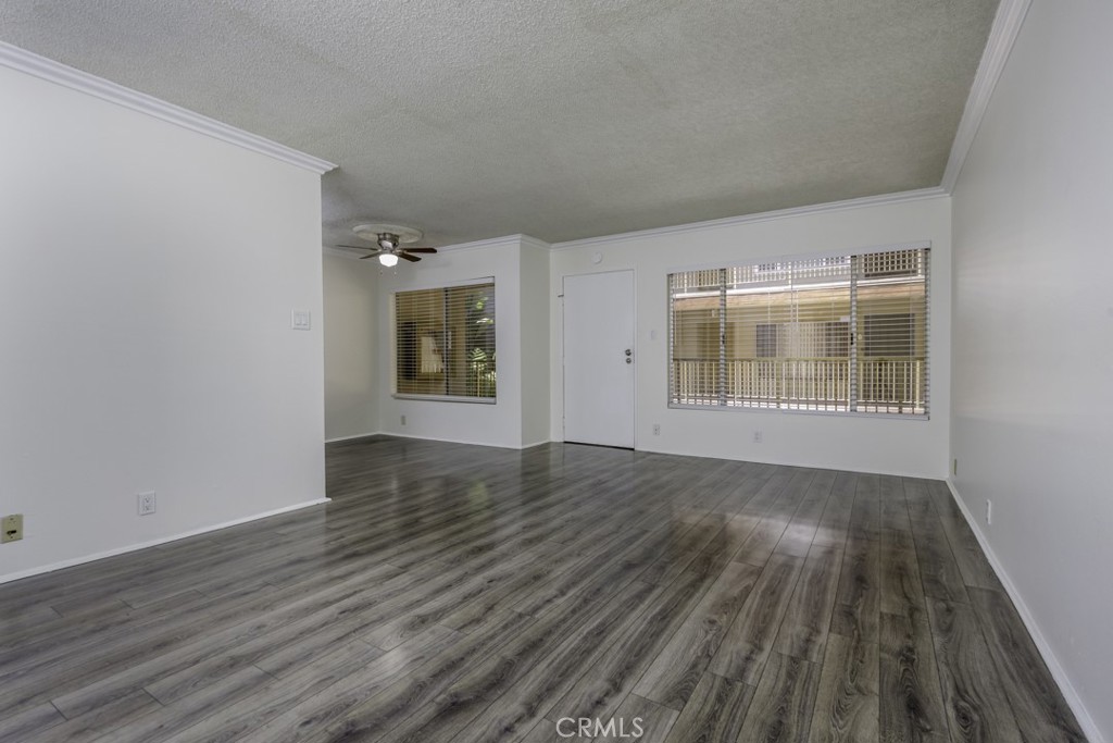 545 Chestnut Avenue, Unit 206 Long Beach, CA 90802 - Photo 1 of 1 an empty room with wooden floor and windows