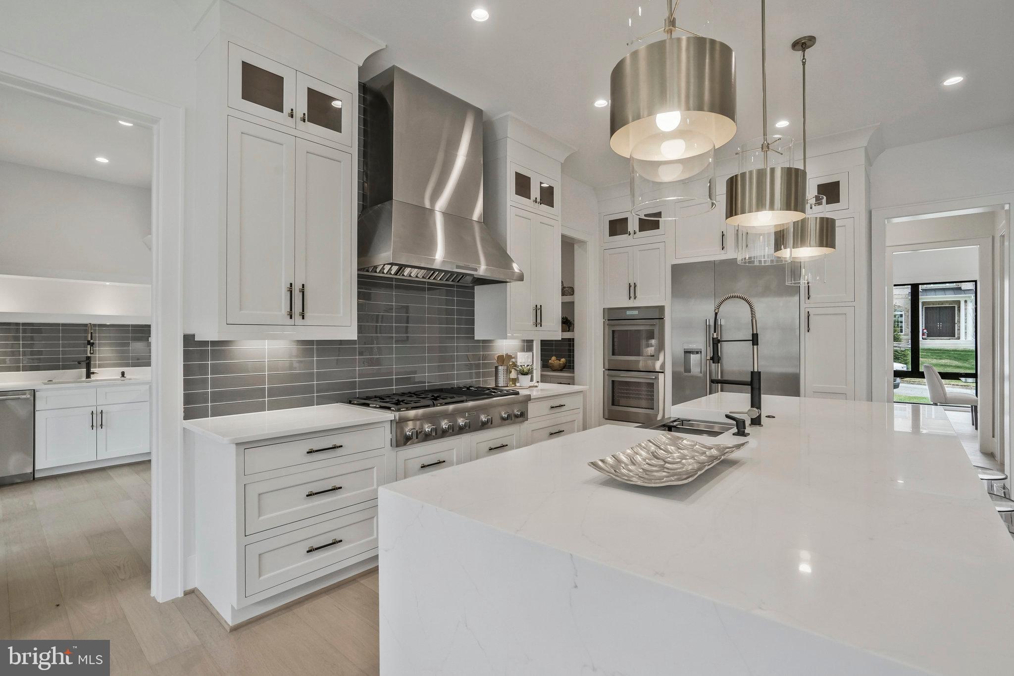 1426 Cola Drive McLean, VA 22101 - Photo 25 of 73 Quartz counter tops and modern smooth glass tile