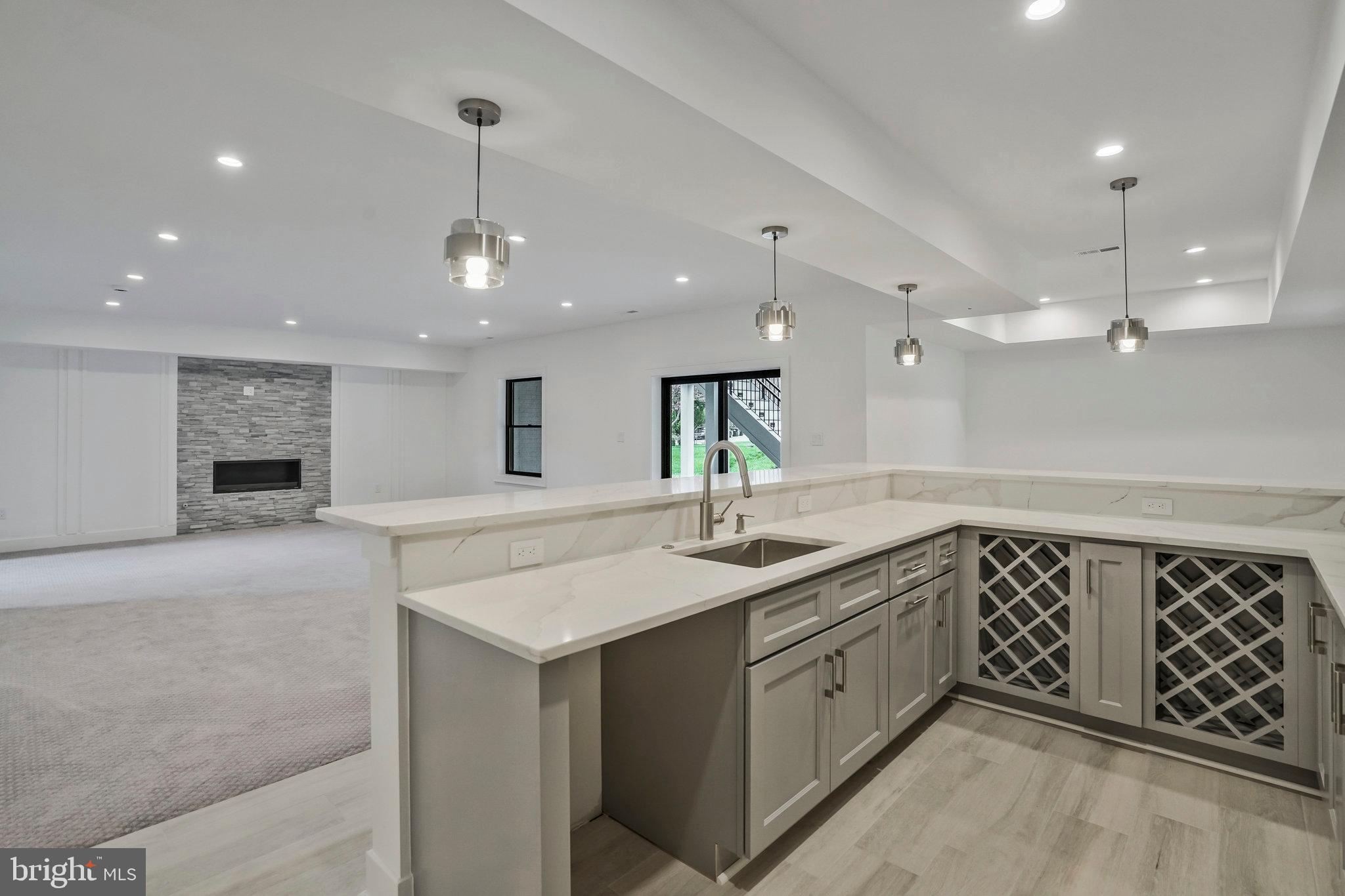 1426 Cola Drive McLean, VA 22101 - Photo 58 of 73 Wet bar with sink and dual wine cabinet