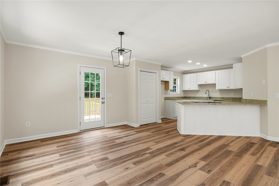 131 Lockaby Road Pelzer, SC 29669 - Photo 17 of 50 This inviting space features durable flooring and a well-appointed kitchen, ideal for daily living.
