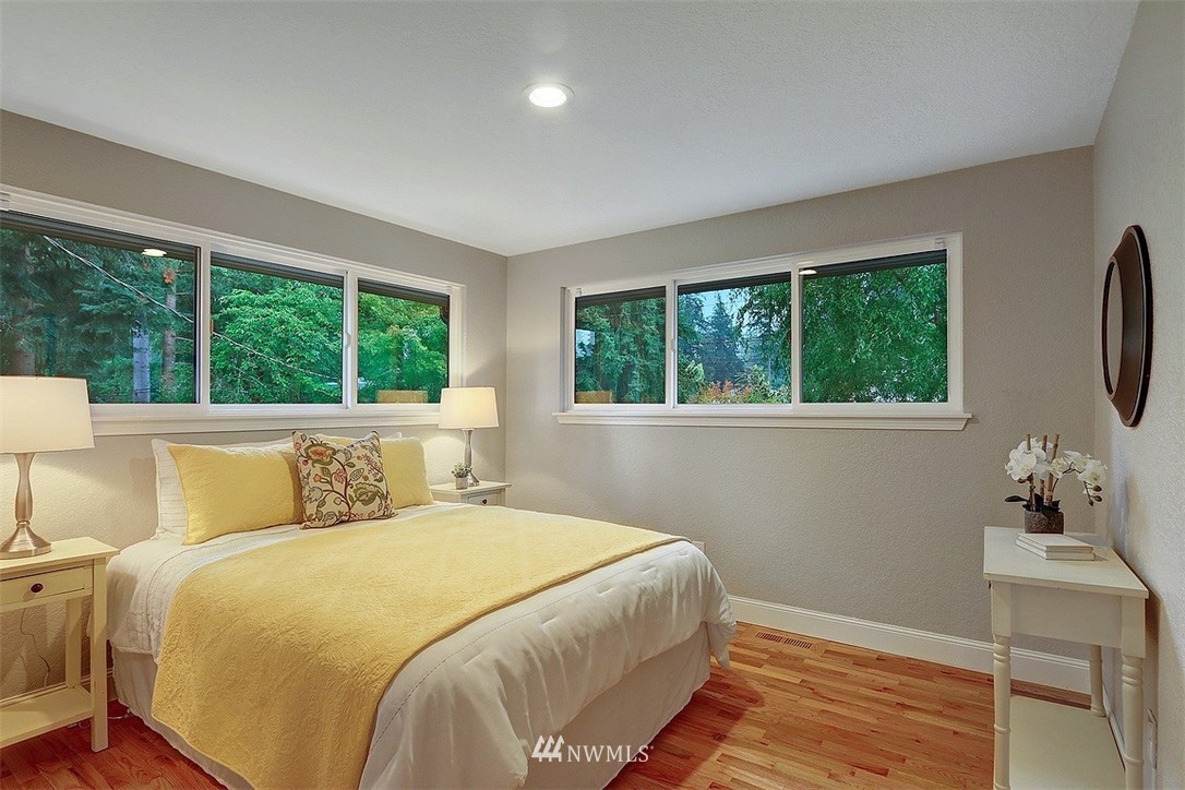 310 175th Place Southwest Bothell, WA 98012 - Photo 14 of 40 a bed sitting in a bedroom next to a window