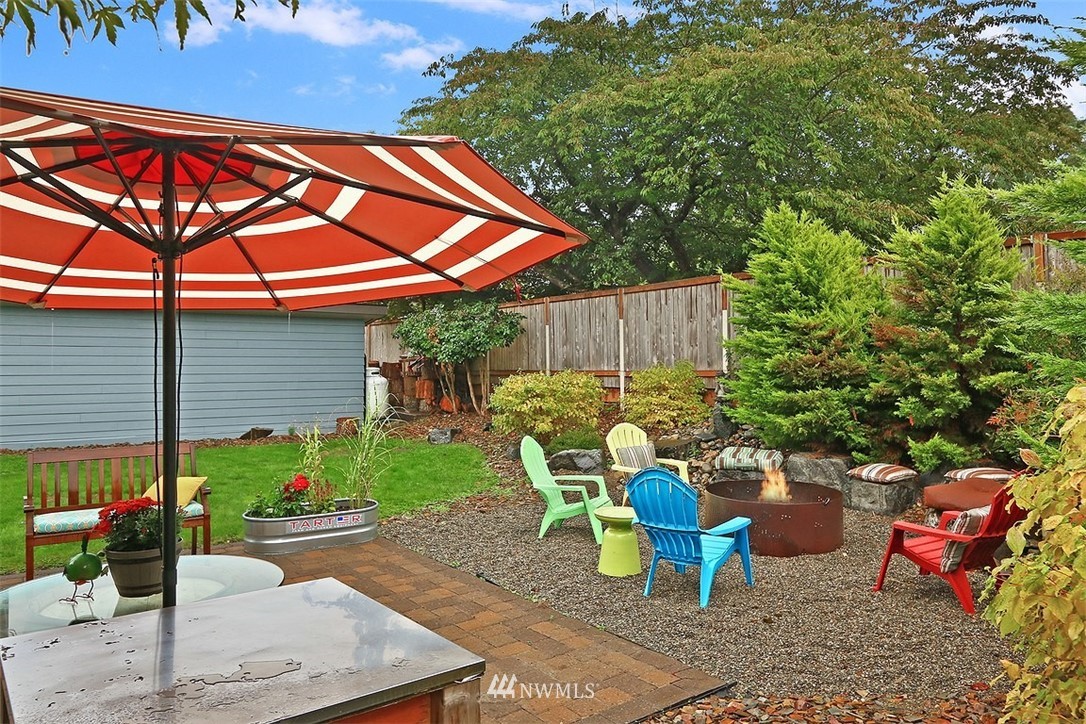 310 175th Place Southwest Bothell, WA 98012 - Photo 29 of 40 a view of a chairs and table in backyard