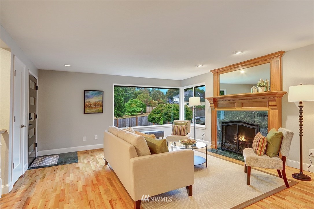 310 175th Place Southwest Bothell, WA 98012 - Photo 5 of 40 a living room with furniture and a fireplace
