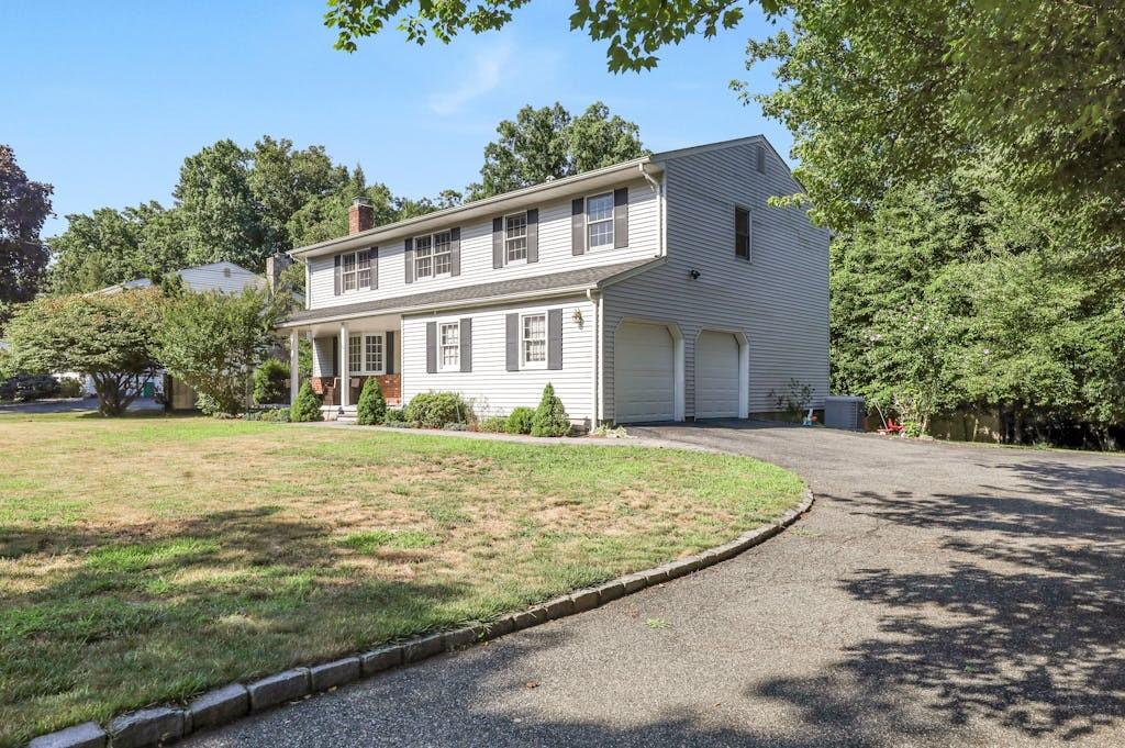 188 Liberty Road Tappan, NY 10983 - Photo 1 of 1 Colonial home featuring a garage, cooling unit, and a front yard