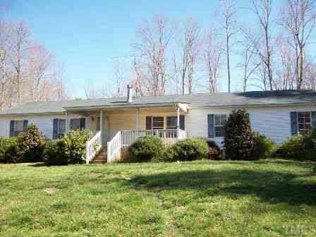 322 Gabriel Jones Road Roxboro, NC 27574 - Photo 1 of 12 a front view of house with yard and green space