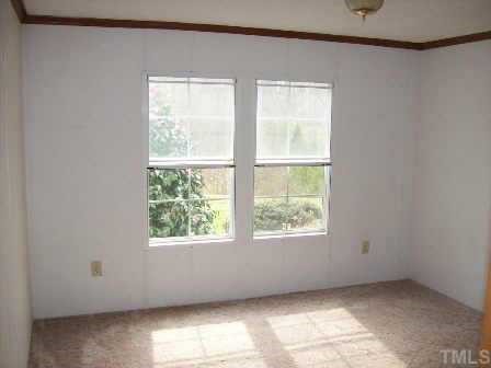 322 Gabriel Jones Road Roxboro, NC 27574 - Photo 10 of 12 an empty room with windows