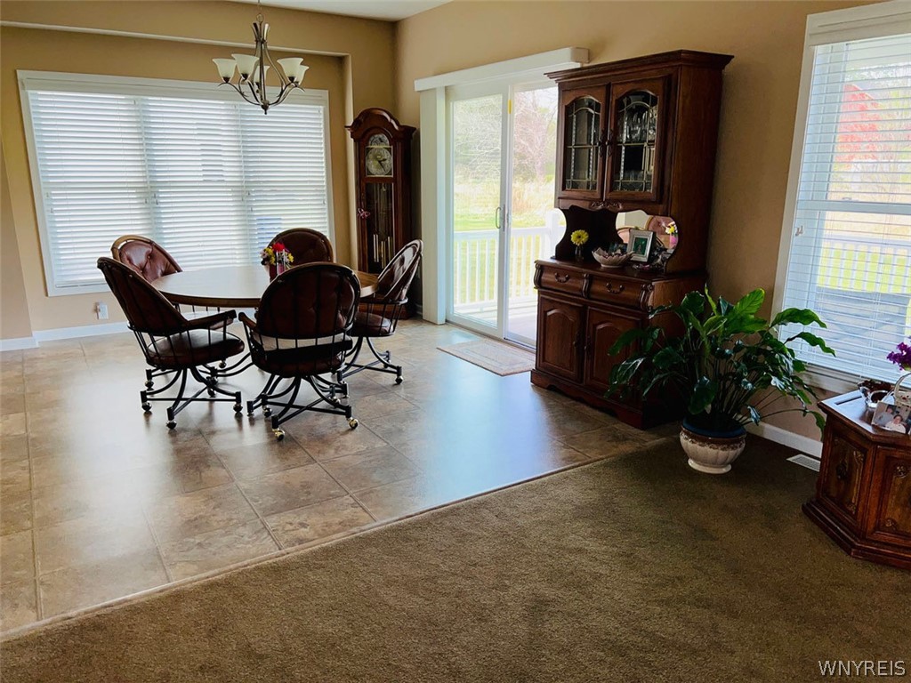28 Willow Wind Trail Ogden, NY 14624 - Photo 14 of 38 Dinging ara opens to Living Room and Kitchen