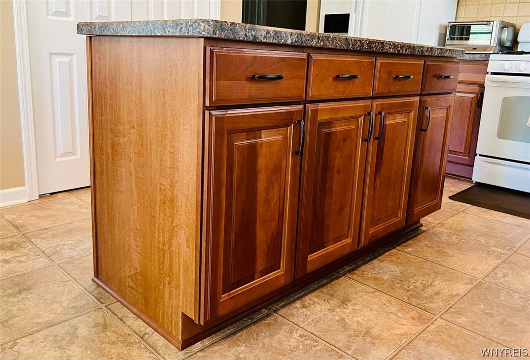 28 Willow Wind Trail Ogden, NY 14624 - Photo 16 of 38 Island with storage provides a great convenience