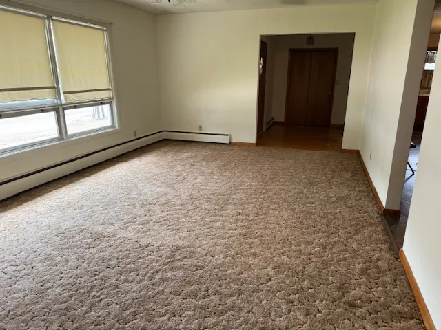 a view of an empty room with a window