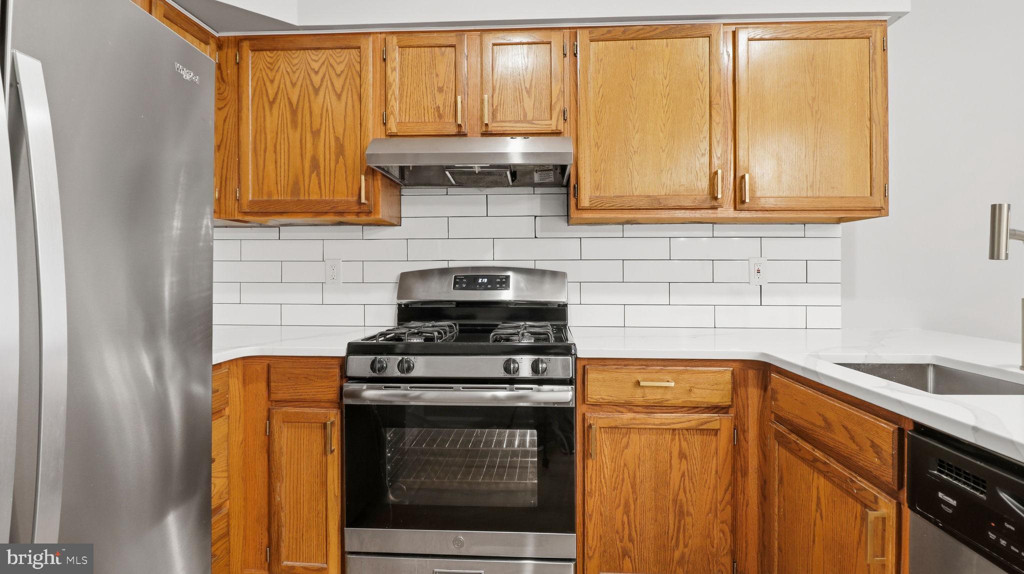 5106 Tall Pines Pine Hill, NJ 08021 - Photo 17 of 35 Modern kitchen with warm wood accents.