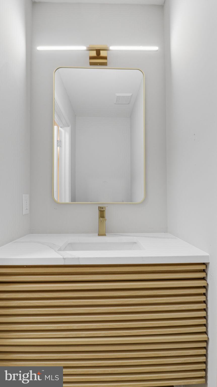 5106 Tall Pines Pine Hill, NJ 08021 - Photo 20 of 35 Sleek modern bathroom with elegant accents.