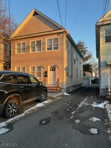 a car parked in front of a house