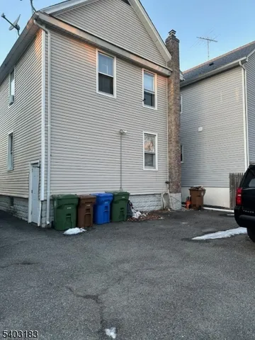 a view of car parked in front of house