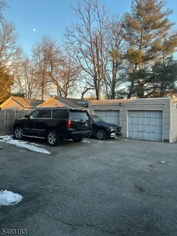 a view of a house with a yard and roof