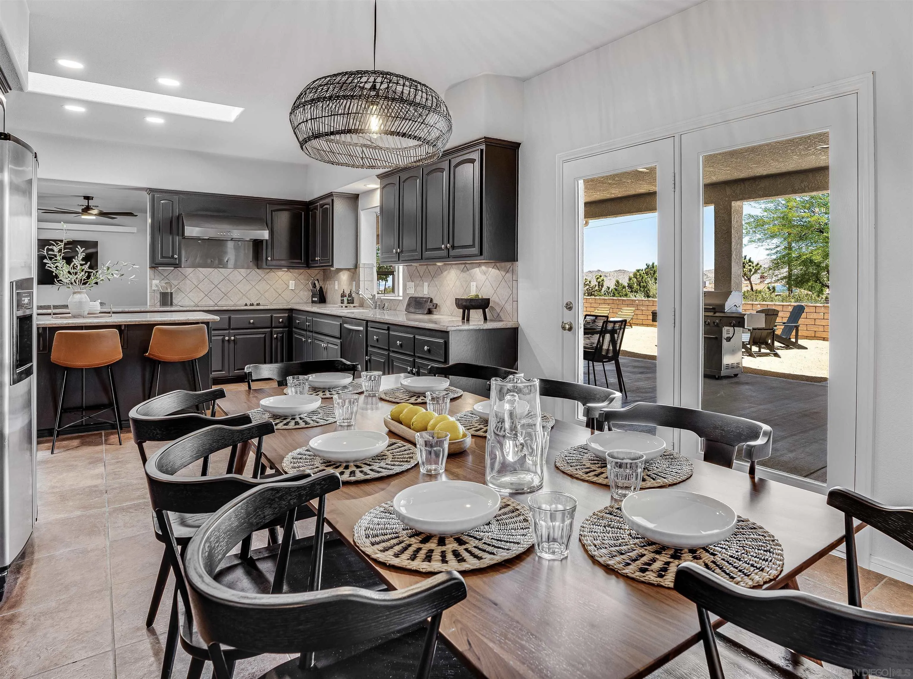 9255 Del Monte Avenue Yucca Valley, CA 92284 - Photo 11 of 46 a kitchen with a dining table and chairs
