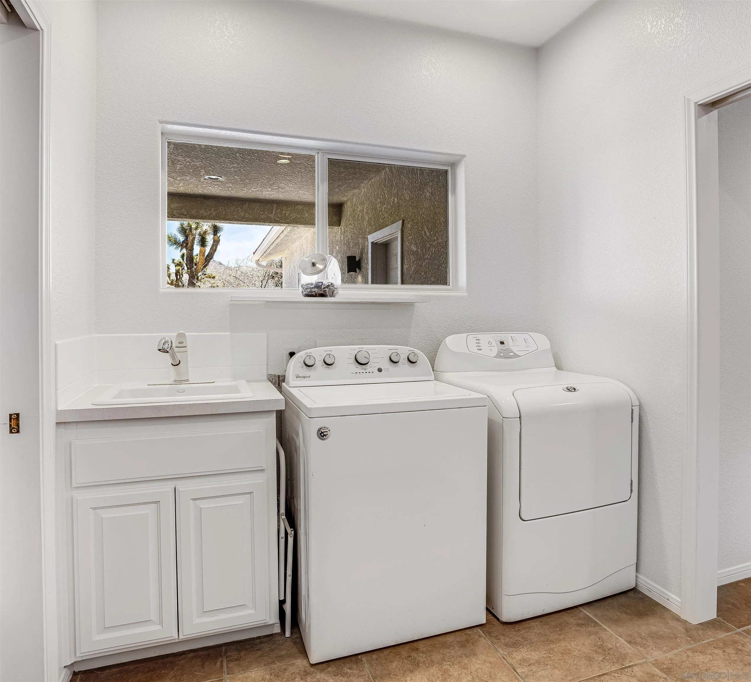 9255 Del Monte Avenue Yucca Valley, CA 92284 - Photo 12 of 46 a utility room with dryer and washer