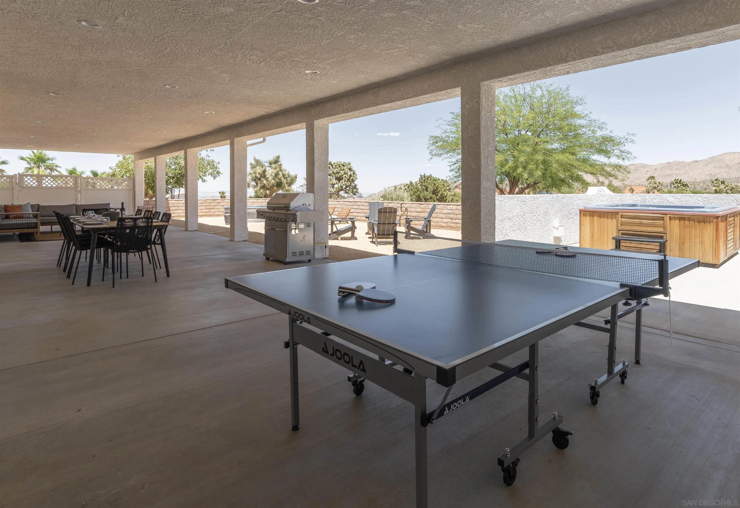 9255 Del Monte Avenue Yucca Valley, CA 92284 - Photo 39 of 46 a view of a dining room with furniture and window