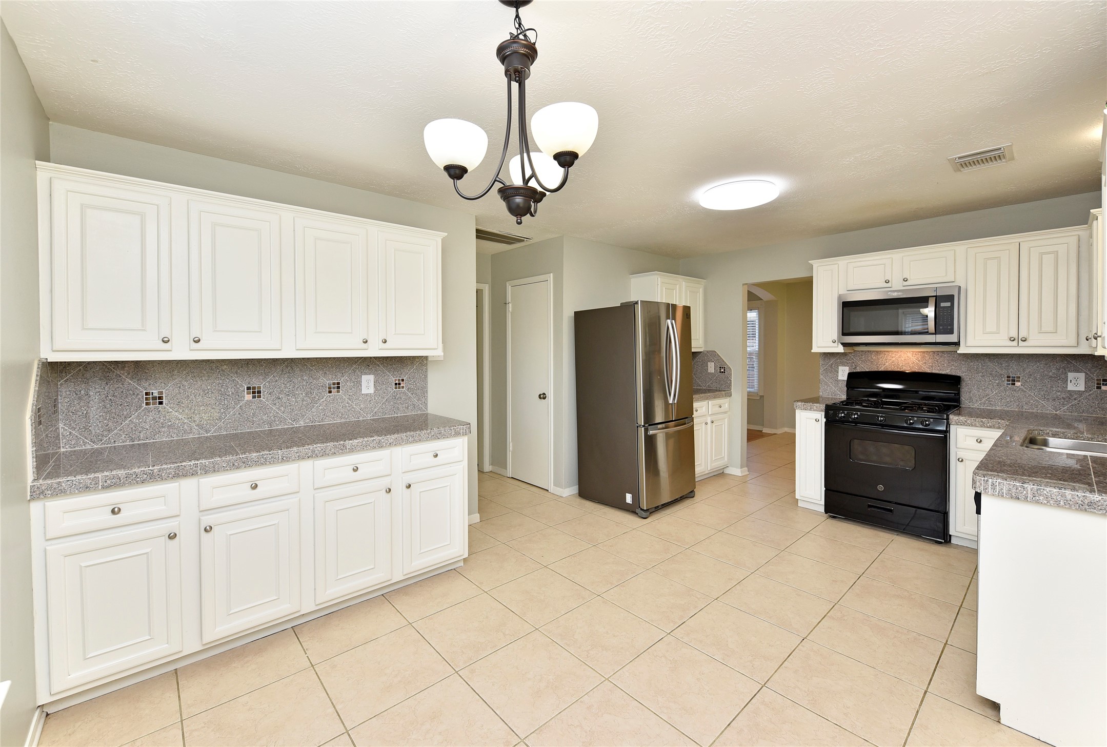 31106 Pine Bay Street Spring, TX 77386 - Photo 15 of 38 Endless possibilities exist with all of the cabinet and counter space in this breakfast room and kitchen!