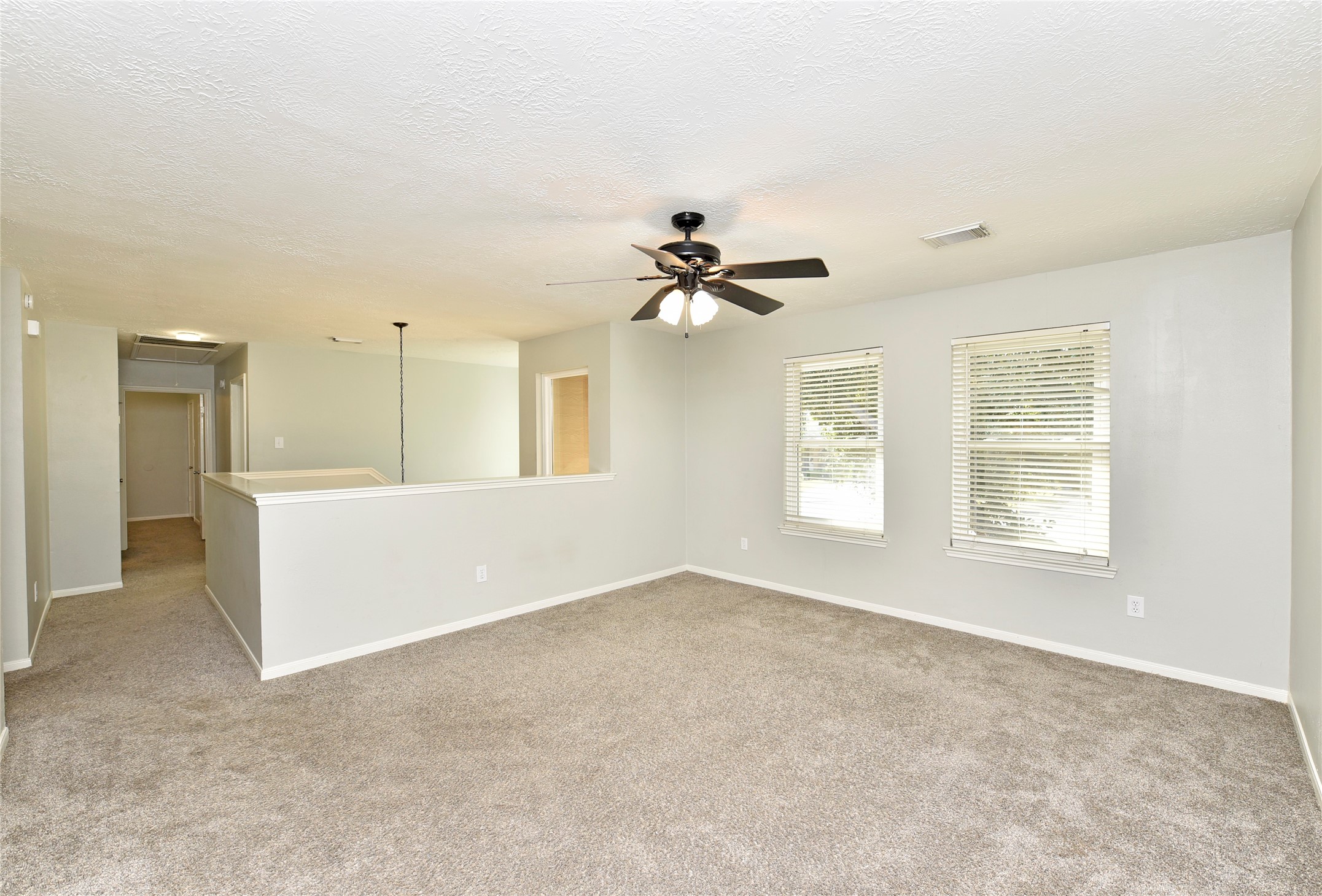 31106 Pine Bay Street Spring, TX 77386 - Photo 19 of 38 The open layout overlooks the stairwell, creating a sense of openness, and multiple outlets along the walls ensure convenient connectivity for electronics and gaming equipment.
