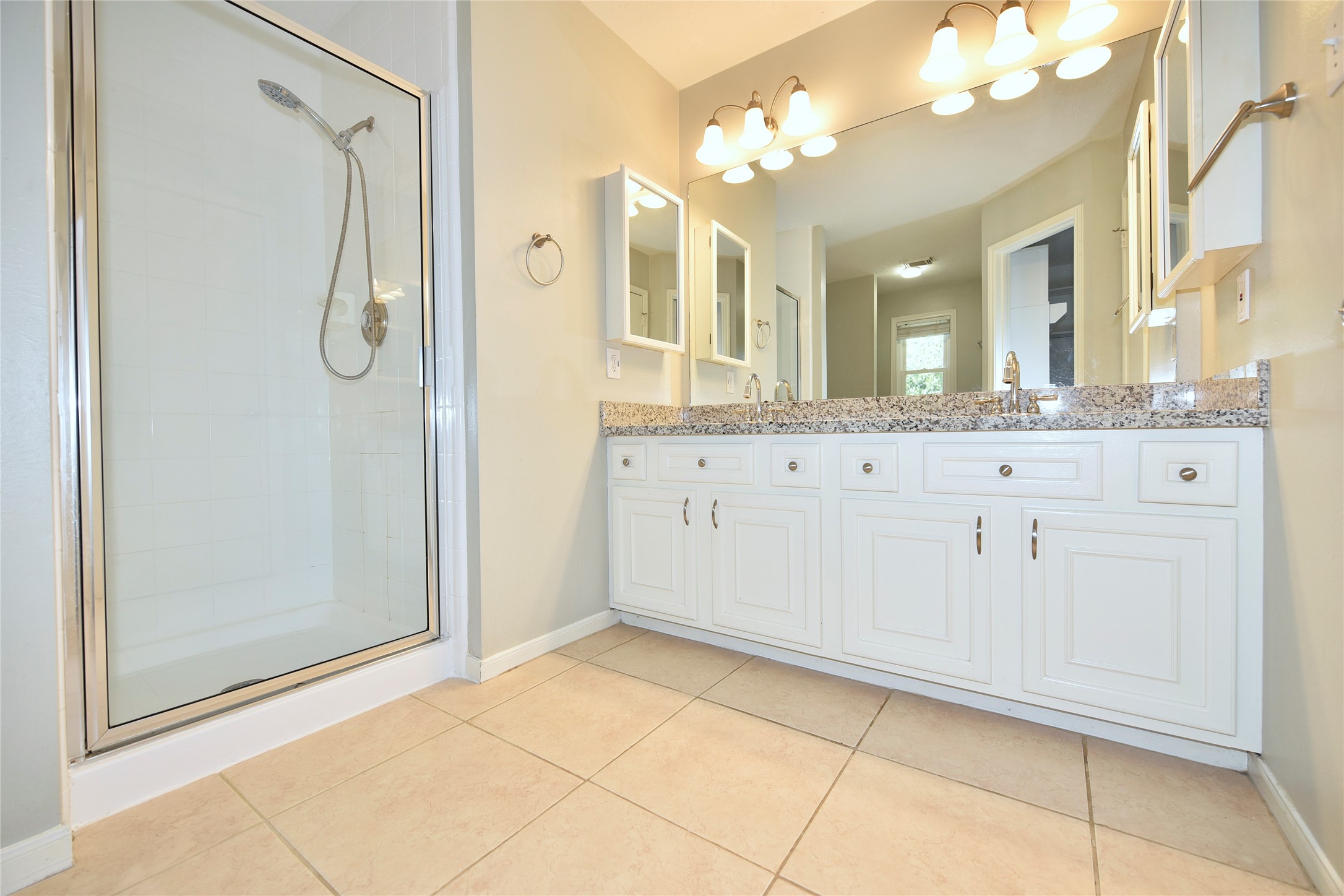 31106 Pine Bay Street Spring, TX 77386 - Photo 23 of 38 a bathroom with a granite countertop sink mirror and shower