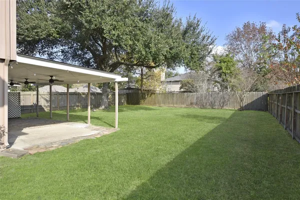 a view of a backyard with a small cabin