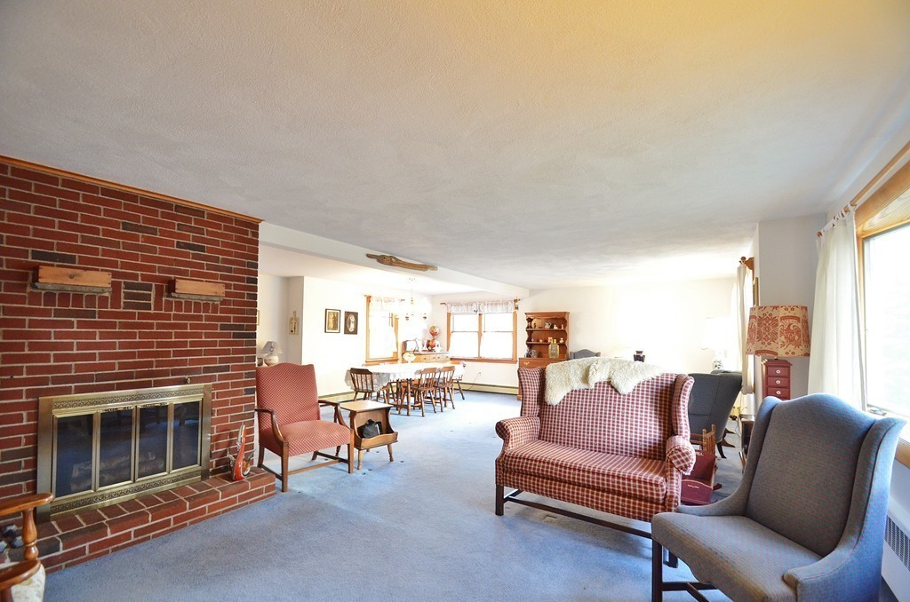 22 Carson Road Woburn, MA 01801 - Photo 3 of 20 a living room with furniture and a fireplace