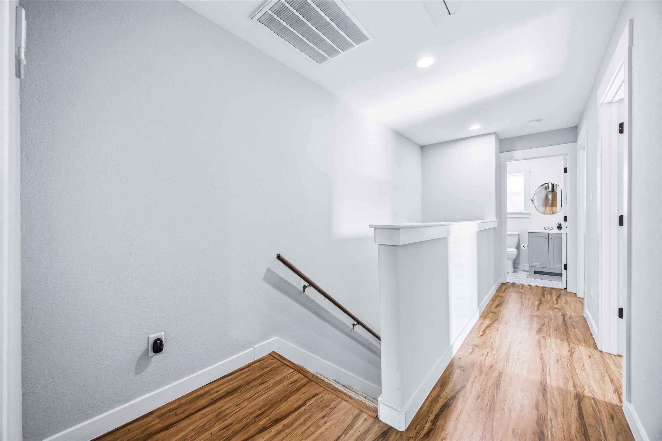 5403 Amy Street Houston, TX 77028 - Photo 15 of 27 a view of a room with wooden floor and staircase