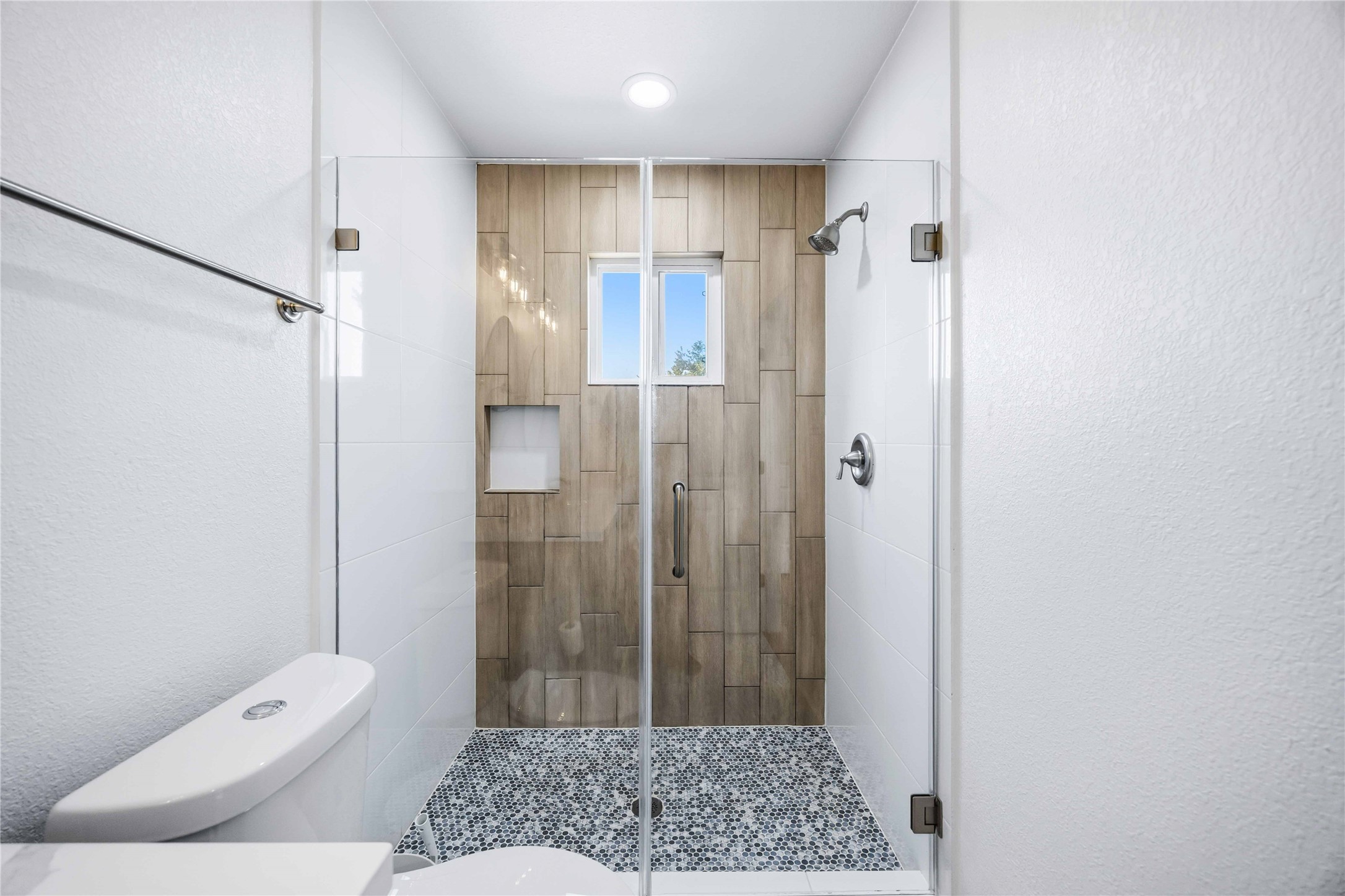 5403 Amy Street Houston, TX 77028 - Photo 19 of 27 a bathroom with a shower and a toilet