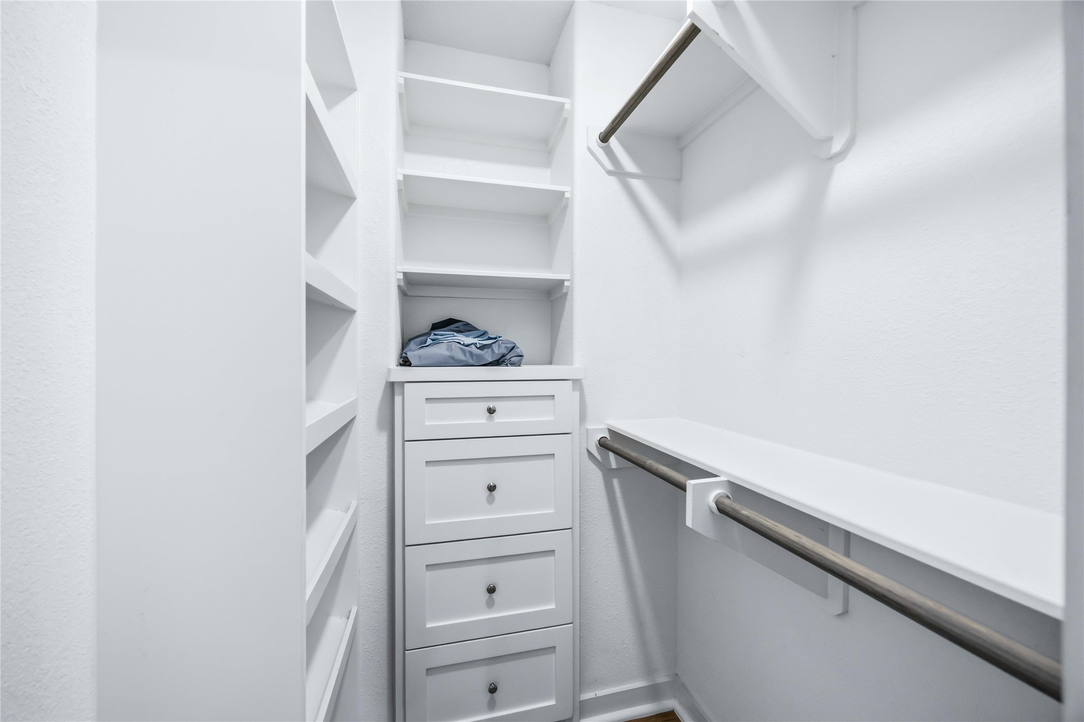 5403 Amy Street Houston, TX 77028 - Photo 20 of 27 a view of walk in closet with clothes and shoes