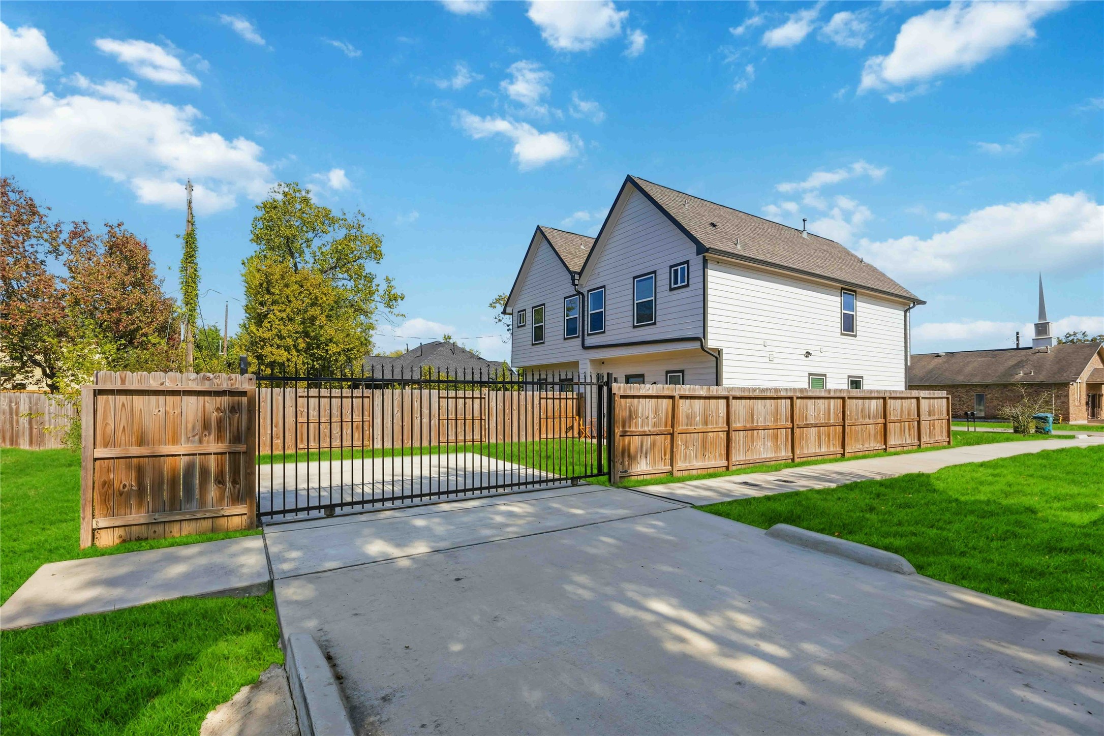 5403 Amy Street Houston, TX 77028 - Photo 23 of 27 a view of a house with a small yard and large trees