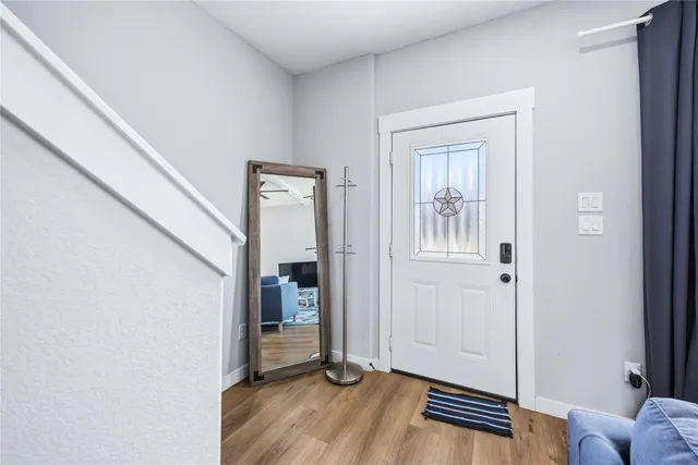 a view of livingroom with furniture and wooden floor