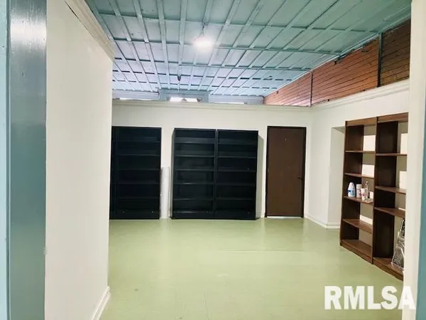 a view of a room with a furniture