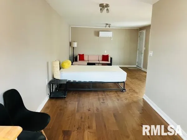 a room with pool table and window