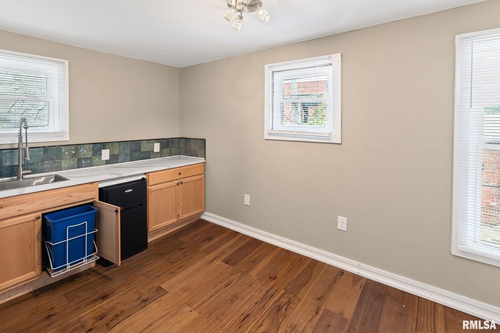 6 South Division Street Du Quoin, IL 62832 - Photo 41 of 47 a view of a kitchen with a sink wooden floor and a window