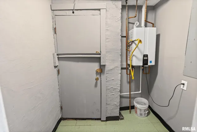 a bathroom with a granite countertop shower and toilet