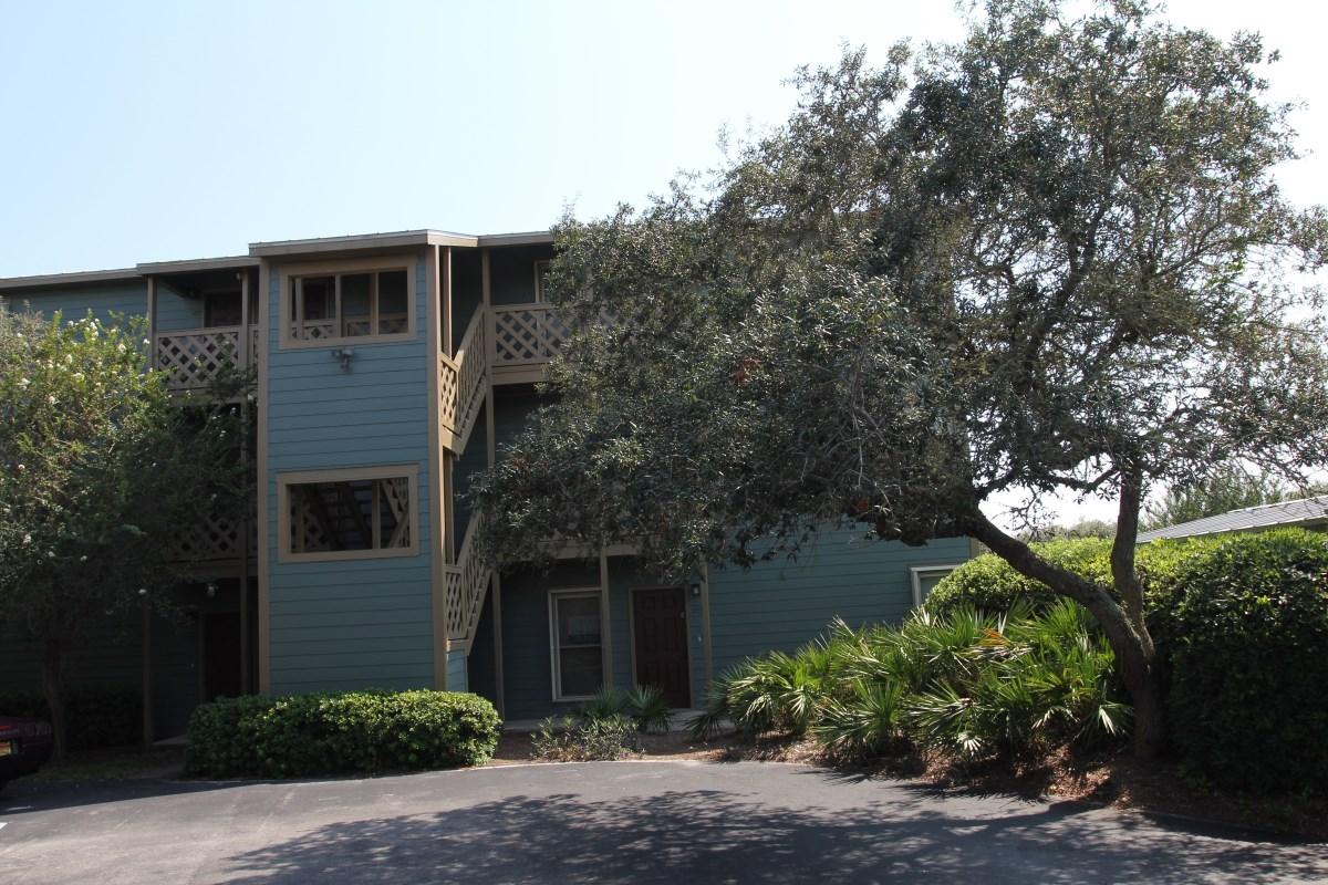 81 South Orange Street, Unit 102 Inlet Beach, FL 32461 - Photo 1 of 14 a front view of a house with plants and garden