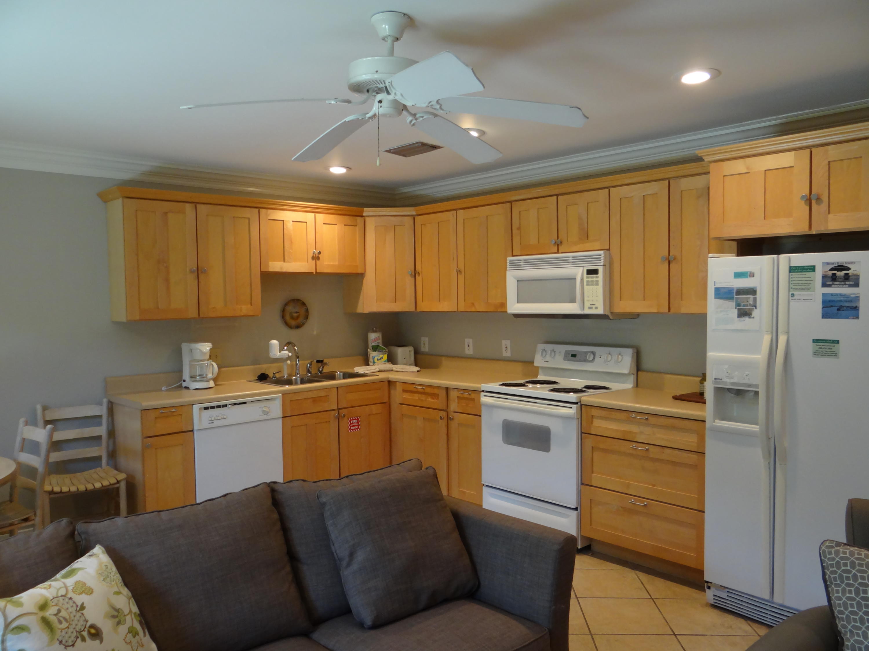 81 South Orange Street, Unit 102 Inlet Beach, FL 32461 - Photo 2 of 14 a kitchen with a stove window and cabinets