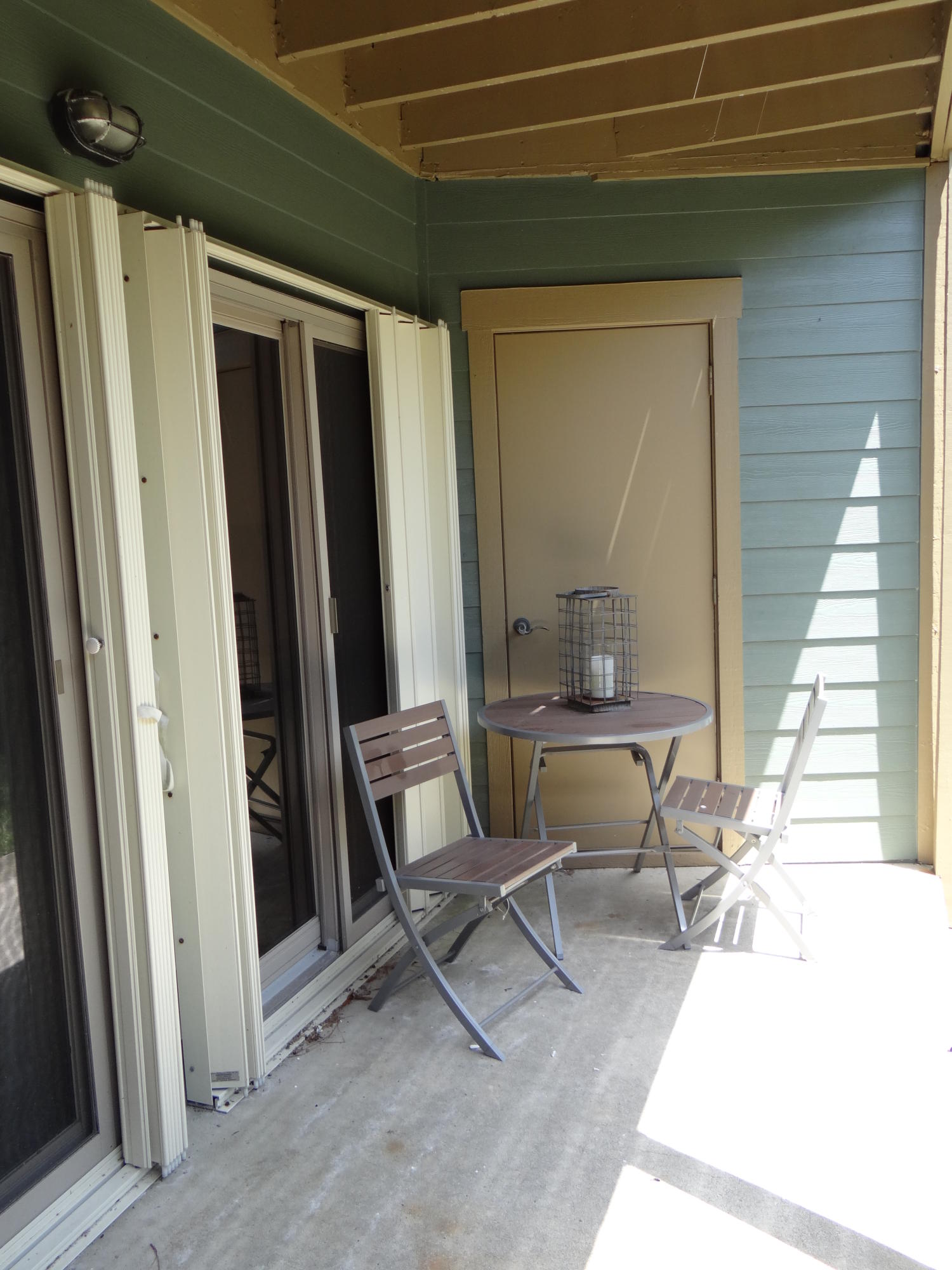 81 South Orange Street, Unit 102 Inlet Beach, FL 32461 - Photo 11 of 14 a chair and table in a porch