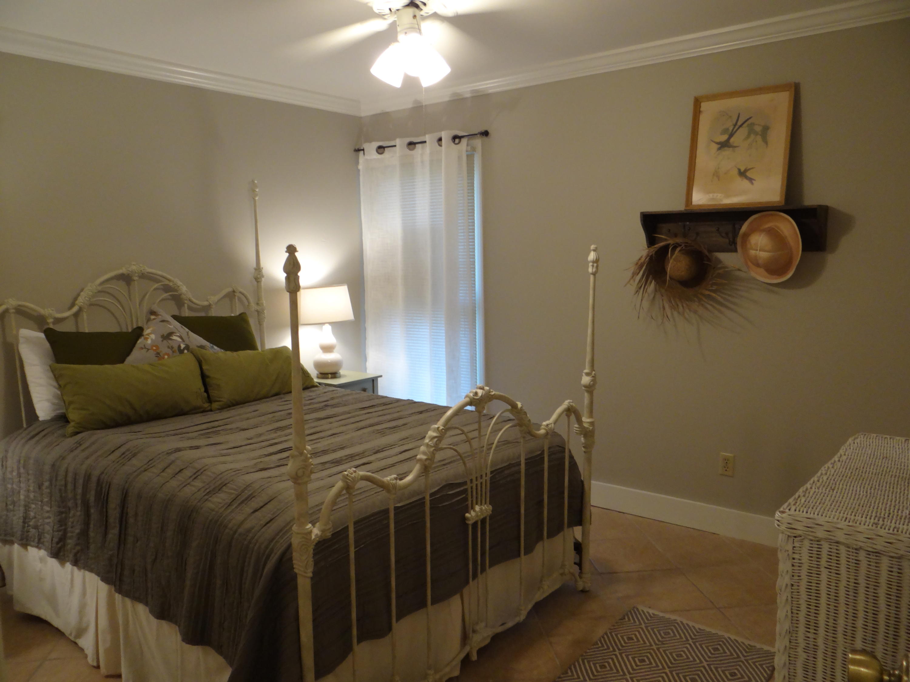 81 South Orange Street, Unit 102 Inlet Beach, FL 32461 - Photo 4 of 14 a bedroom with a bed and wall painting