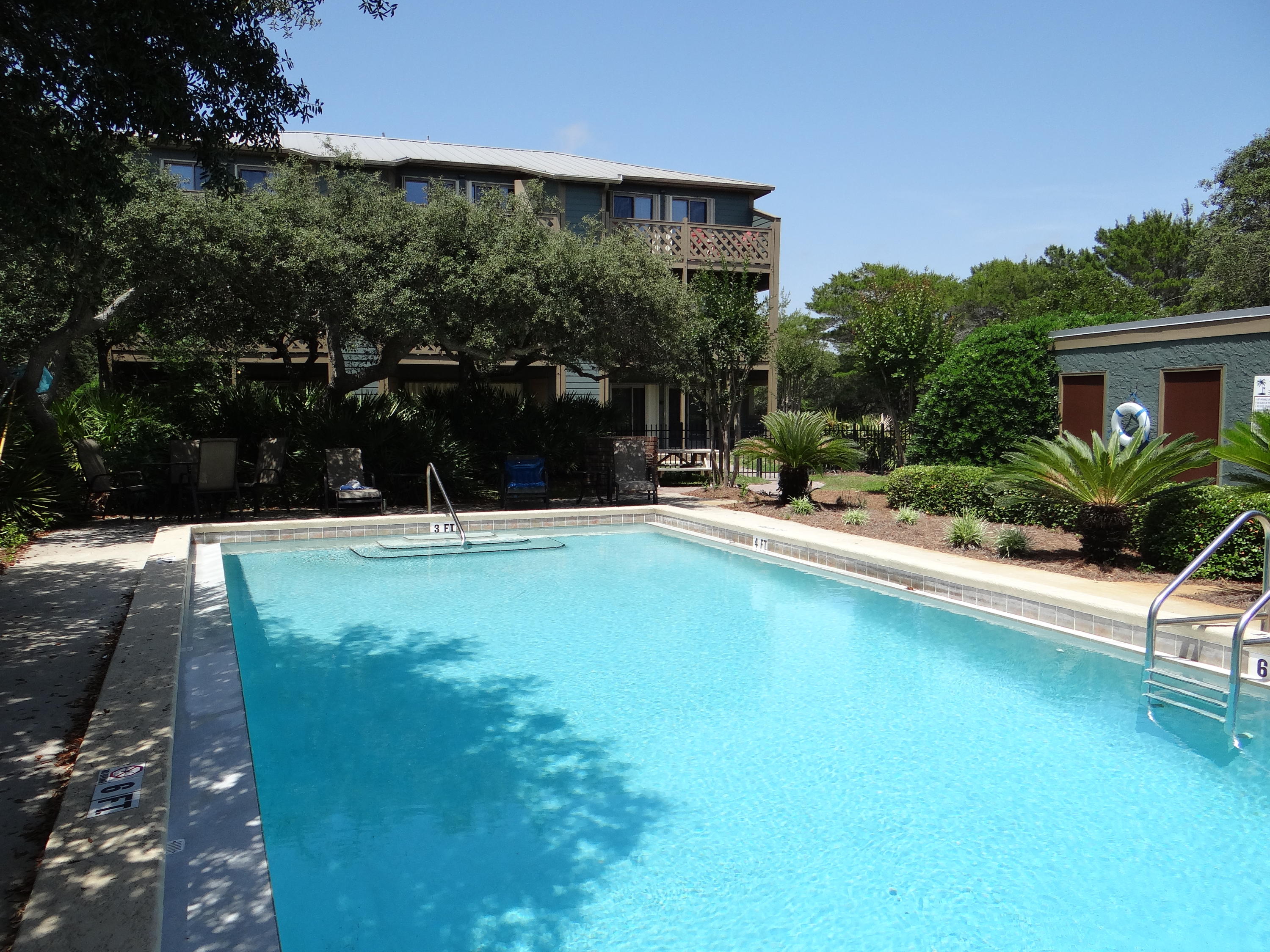 81 South Orange Street, Unit 102 Inlet Beach, FL 32461 - Photo 5 of 14 a swimming pool with outdoor seating and yard