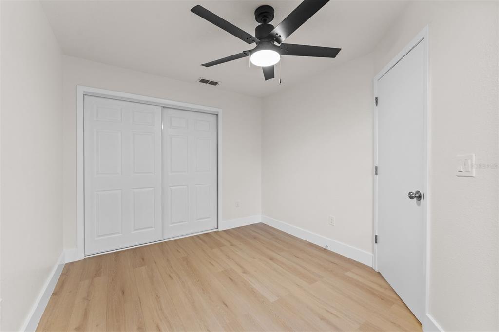 3058 Overlook Place Clearwater, FL 33760 - Photo 25 of 45 wooden floor in an empty room