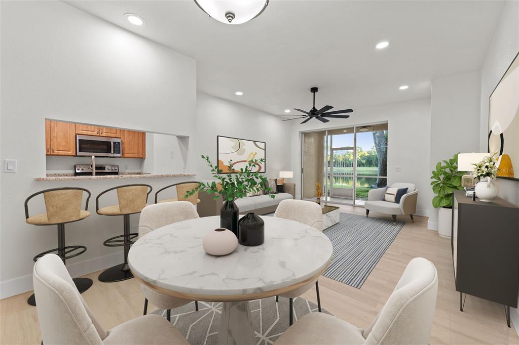 3058 Overlook Place Clearwater, FL 33760 - Photo 7 of 45 a living room with furniture a chandelier and a table