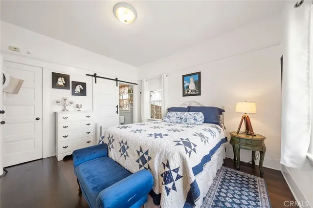 a bedroom with a bed and a view of bathroom